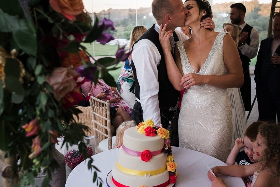 Bride and groom cut the cake at Osmaston Park