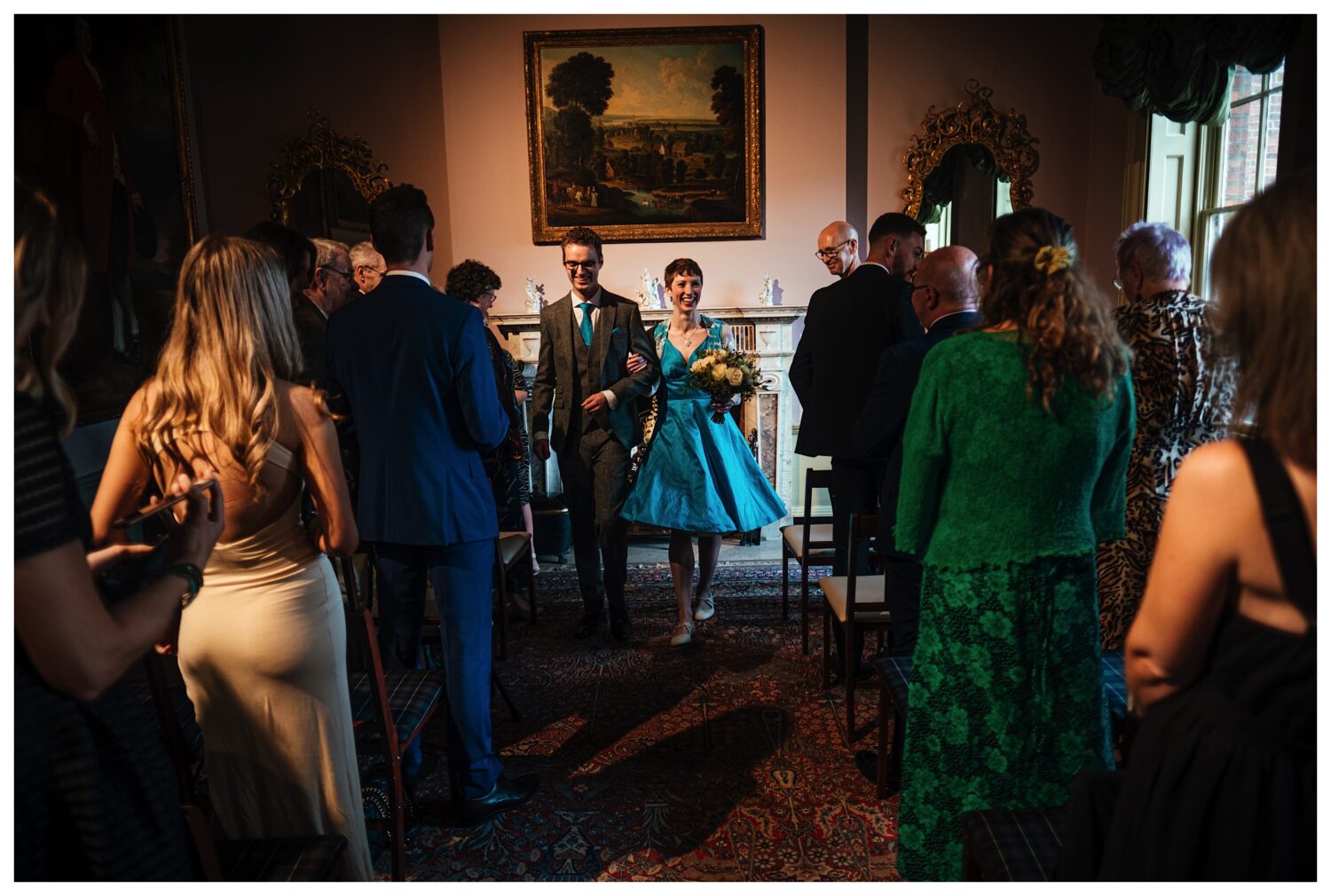 Bride and groom walk back down the aisle at Pickfords House Museum