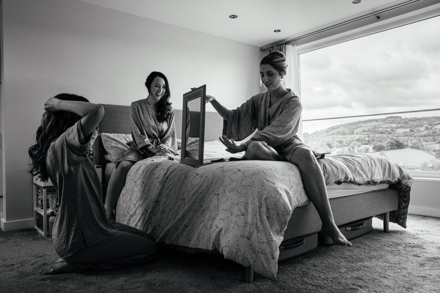 Bride and Bridesmaids doing hair