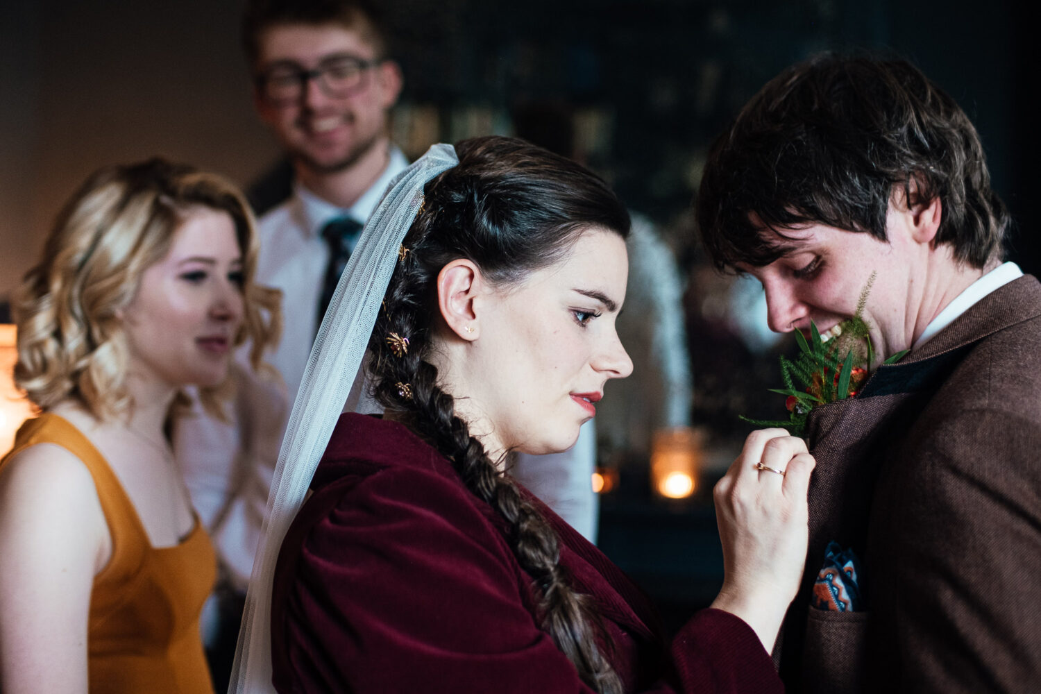 Bride does grooms buttonhole
