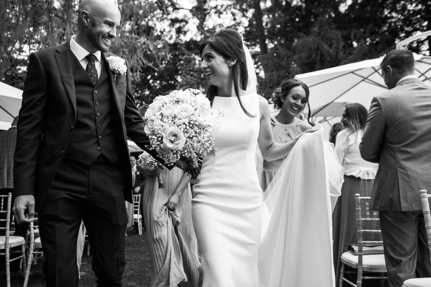 Eyam Hall Wedding Photographer 14 Bride and groom walk back down the aisle at Eyam Hall