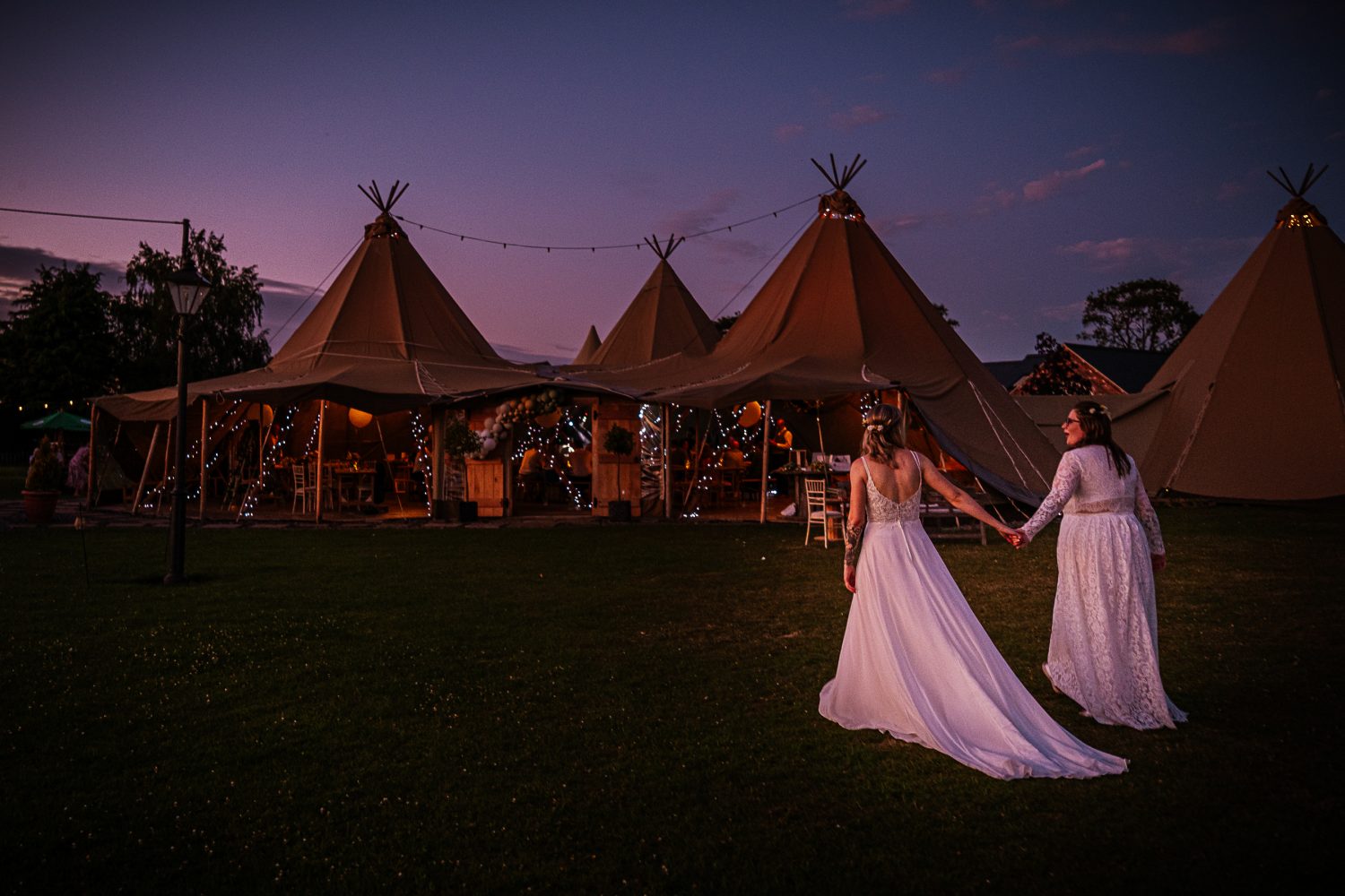 Barn Weddings in Derbyshire: Why the Countryside Is Calling 9 Brides walk towards Tipi