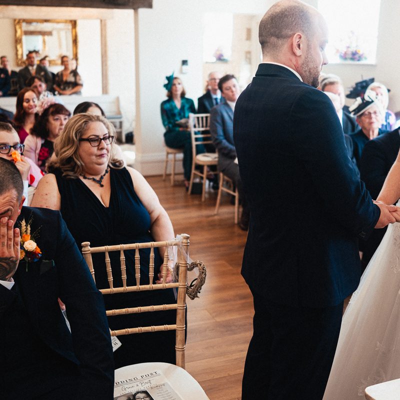 Best man wipes a tear away at Wedding Ceremony Shottle Hall