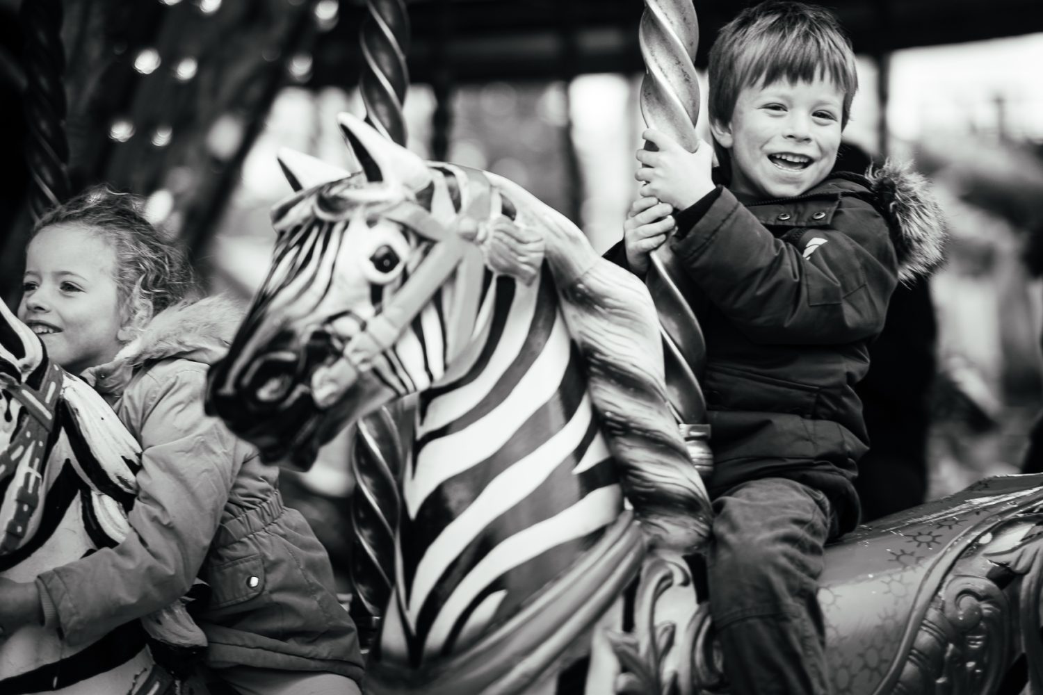 9. riding on a merry go round Children riding on a merry go round