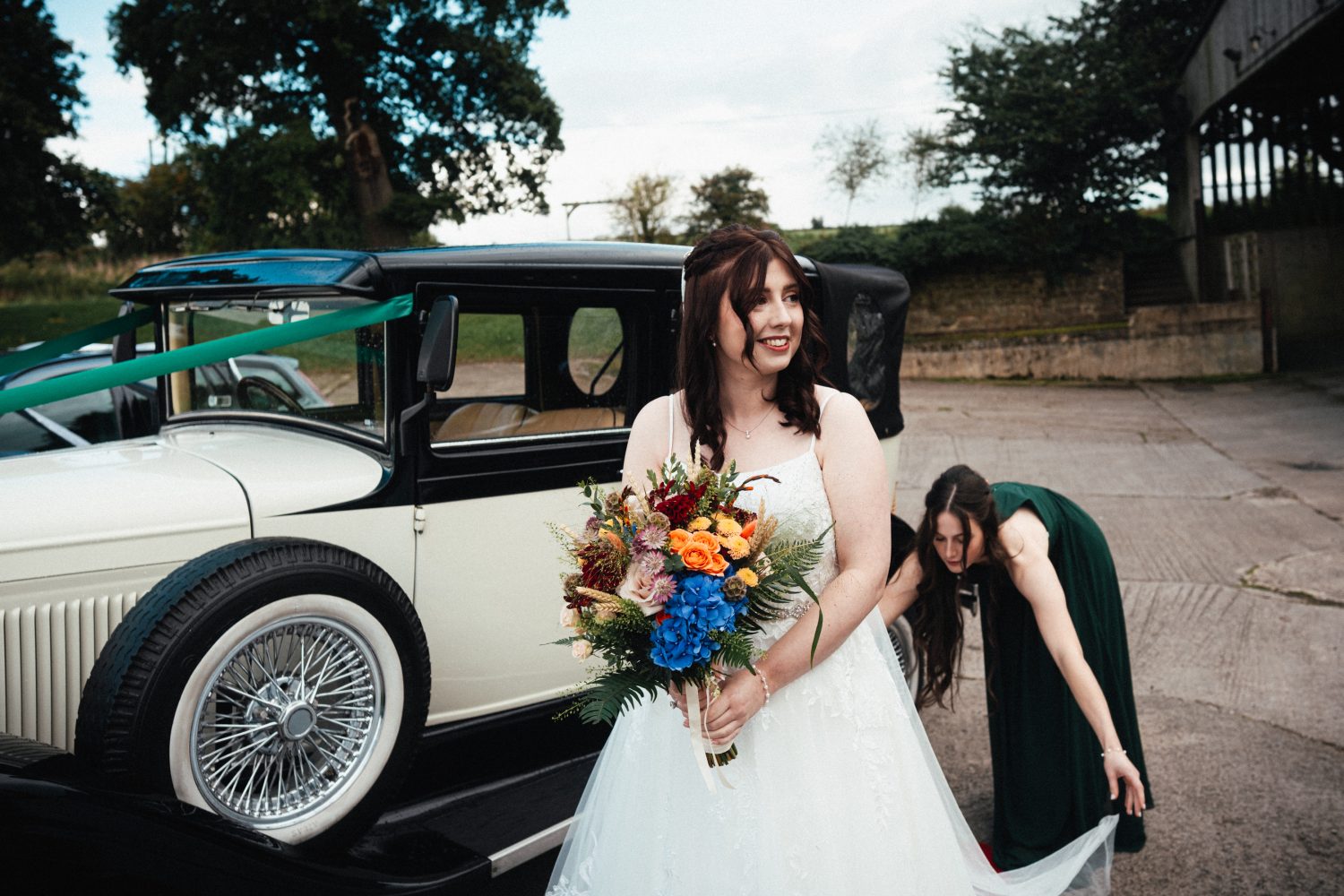 Bride arriving at Shottle Hall in Classic Wedding Car Bride arriving at Shottle Hall in Classic Wedding Car