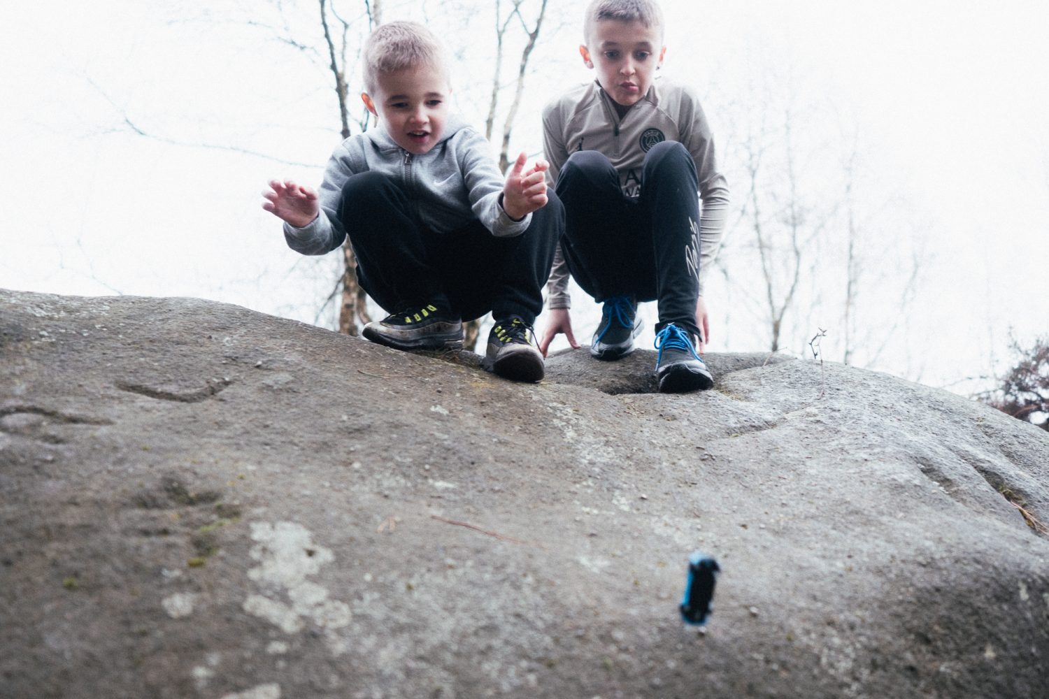 Boys play with Toy car at Black Rock Derbyshire Boys play with Toy car at Black Rock Derbyshire