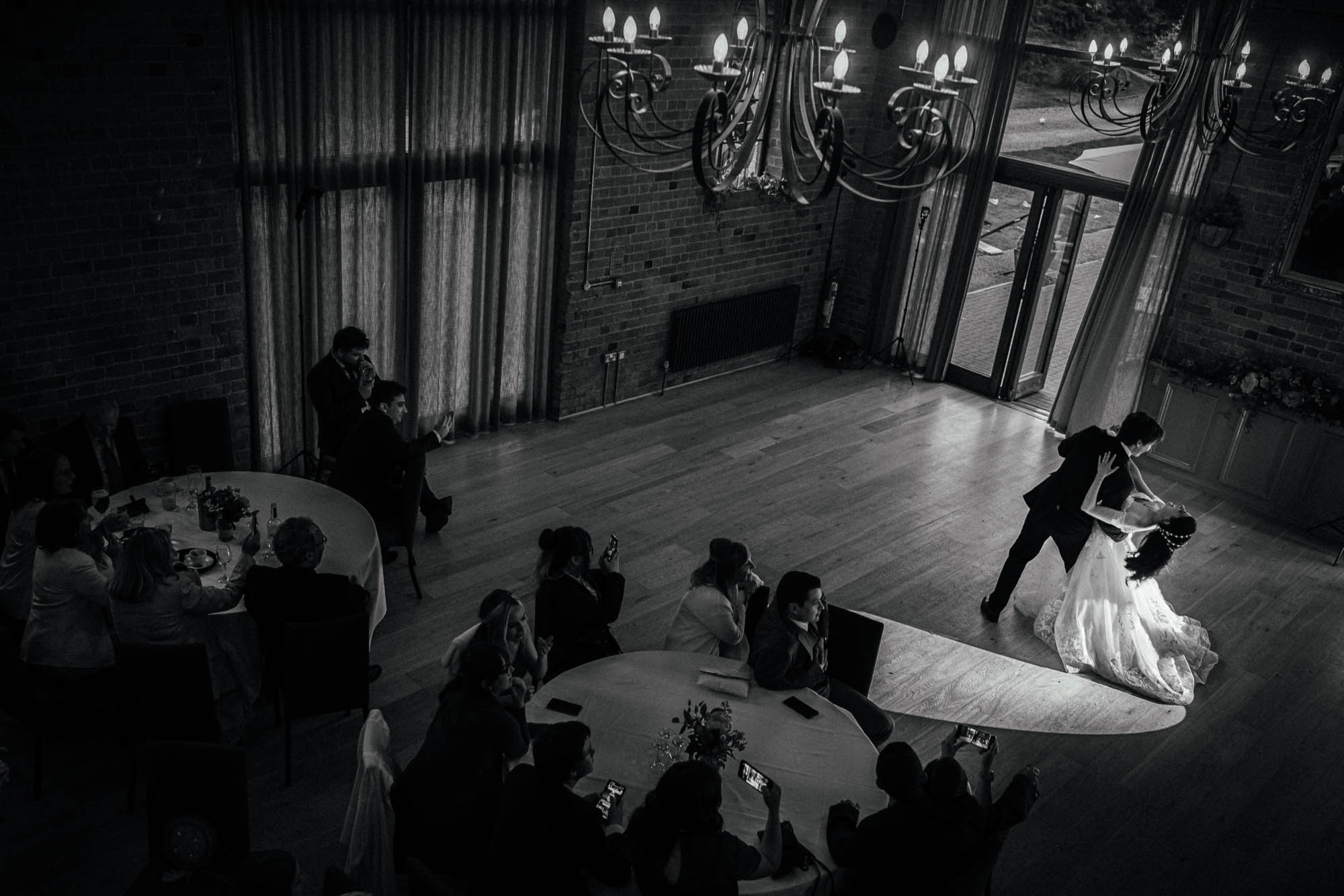 Bride and groom take a dip during first dance at The Carriage hall plum tree