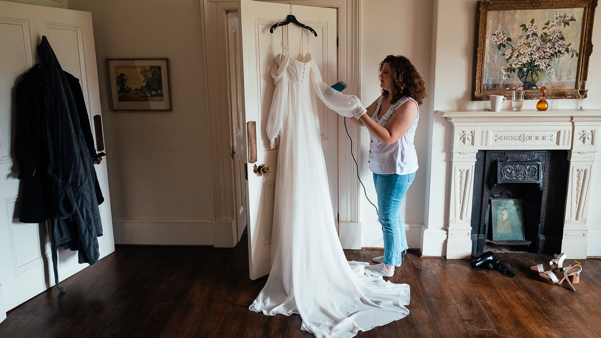 The Ultimate Derbyshire Garden Wedding? 2 Bridesmaid ironing wedding dress