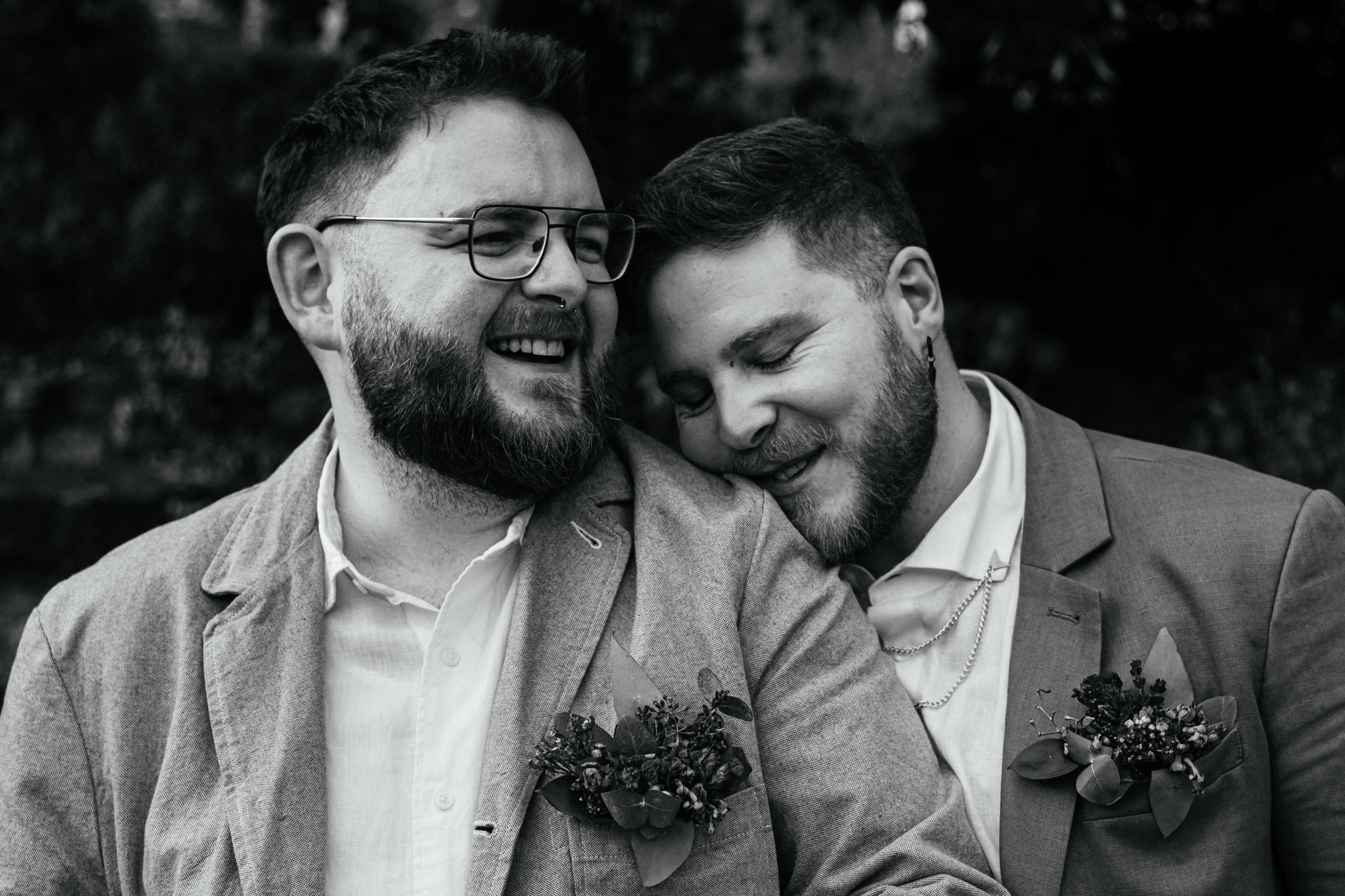Same Sex Couple Portrait - artistic, grainy black and white couple portrait of two grooms on their wedding day. Intimate moment.